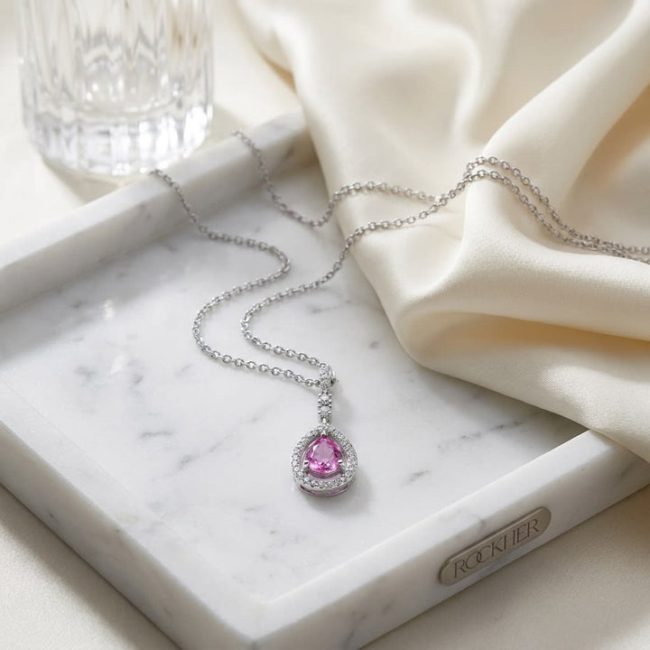Pink Sapphire & Diamond Pendant, on marble vanity tray with silk