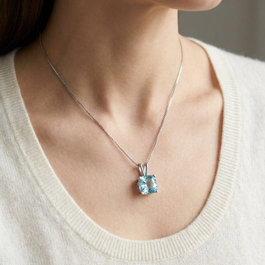Aquamarine Solitaire Pendant in 14K White Gold, worn close-up portrait