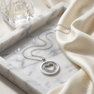 Natural Diamond Heart Shape Pendant in 14K White Gold, on marble vanity tray with silk
