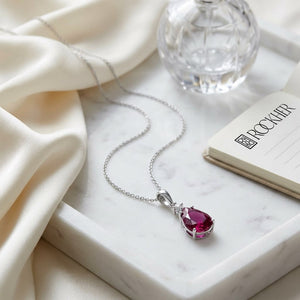 Rhodolite Garnet Pendant in 14K White Gold, on marble vanity tray with silk