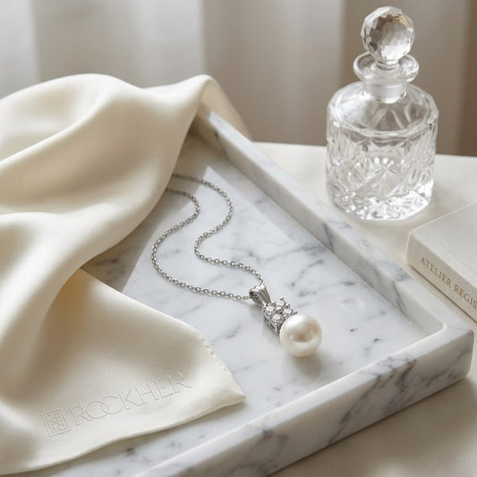 Pearl Pear Shape Pendant in 14K White Gold, on marble vanity tray with silk