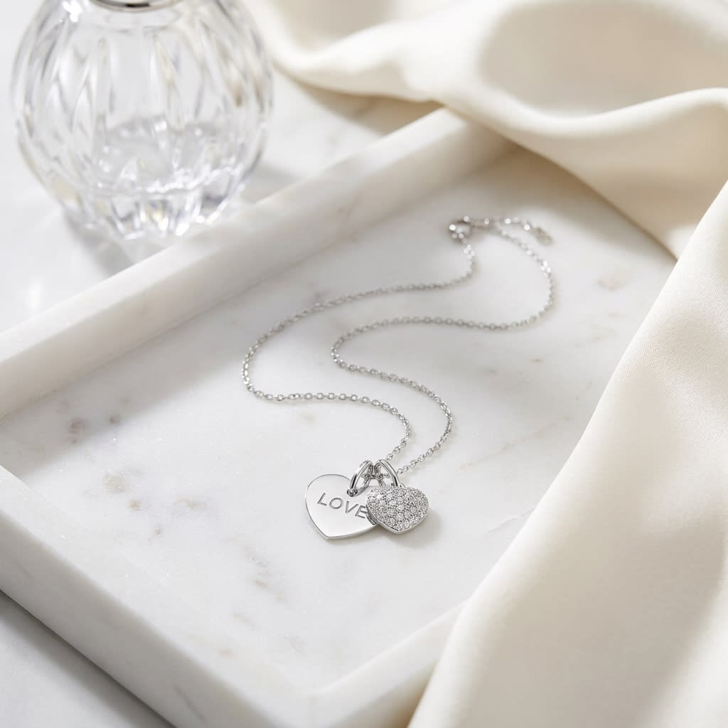 Natural Diamond Heart Shape Pendant in 14K White Gold, on marble vanity tray with silk