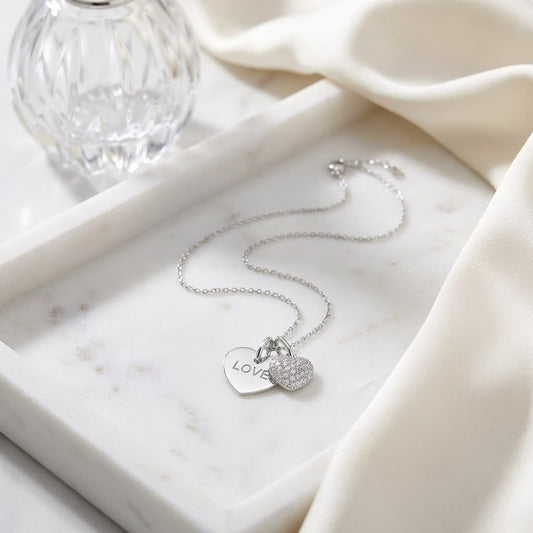 Natural Diamond Heart Shape Pendant in 14K White Gold, on marble vanity tray with silk