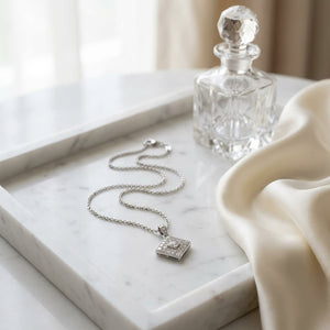 Diamond Cluster Pendant in 14K White Gold, 0.75ct, on marble vanity tray with silk