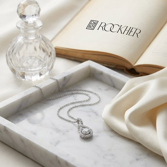 Natural Diamond Round Brilliant Pendant in 14K White Gold, on marble vanity tray with silk