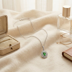 Tsavorite & Diamond Double Oval Halo Pendant 17 in Curb Chain in 14K White Gold - flat lay