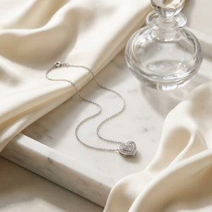 Heart Diamond Pendant in 14K White Gold, 0.39ct, on marble vanity tray with silk