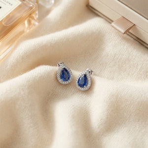 Sapphire & Diamond Teardrop Halo Pendant with Studded Bail in 14K White Gold - flat lay