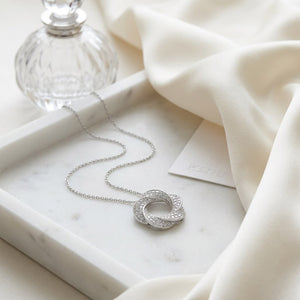 Natural Diamond Round Brilliant Pendant in 14K White Gold, on marble vanity tray with silk