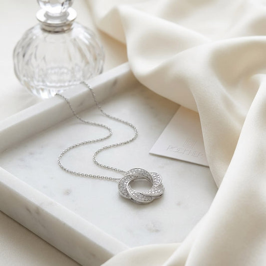 Natural Diamond Round Brilliant Pendant in 14K White Gold, on marble vanity tray with silk