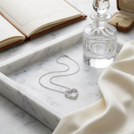 Diamond Heart Pendant in 14K White Gold, on marble vanity tray with silk