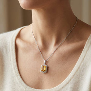 Citrine Emerald Cut Pendant in 14K White Gold, worn close-up portrait