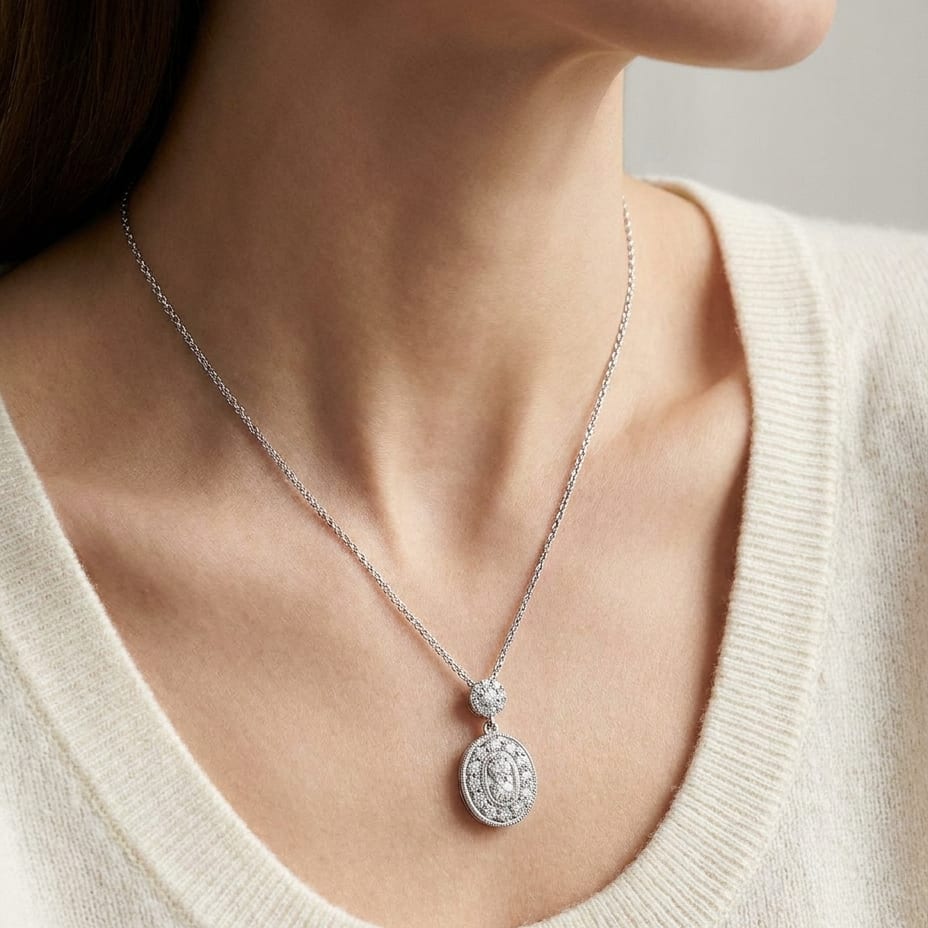 Natural Diamond Oval Halo Pendant in 14K White Gold, 1/3 ct. t.w., worn close-up portrait