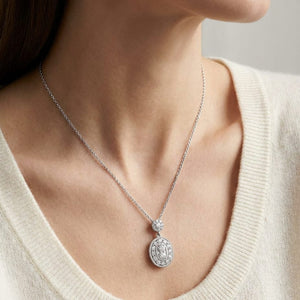 Natural Diamond Oval Halo Pendant in 14K White Gold, 1/3 ct. t.w., worn close-up portrait