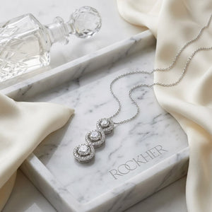 Natural Diamond Round Brilliant Pendant in 14K White Gold, on marble vanity tray with silk