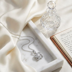 Natural Diamond Round Brilliant Pendant in 14K White Gold, on marble vanity tray with silk
