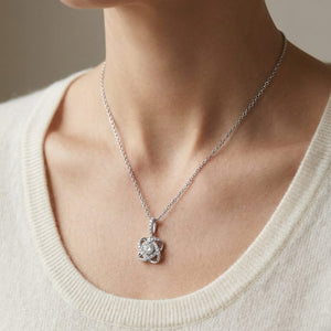 Natural Diamond Round Brilliant Pendant in 14K White Gold, worn close-up portrait