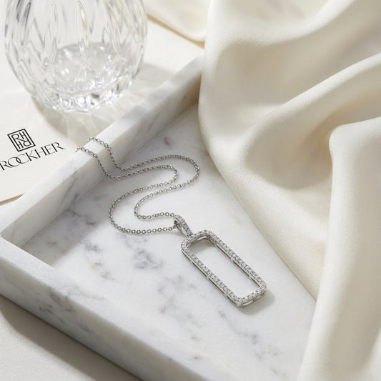 Diamond Open Rectangle Necklace In 14k White Gold 0.42ctw, 18 Inch Rolo Chain, on marble vanity tray with silk