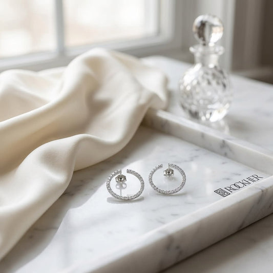Diamond Open Circle Earrings in 14K White Gold 3/4ctw, on marble vanity tray with silk