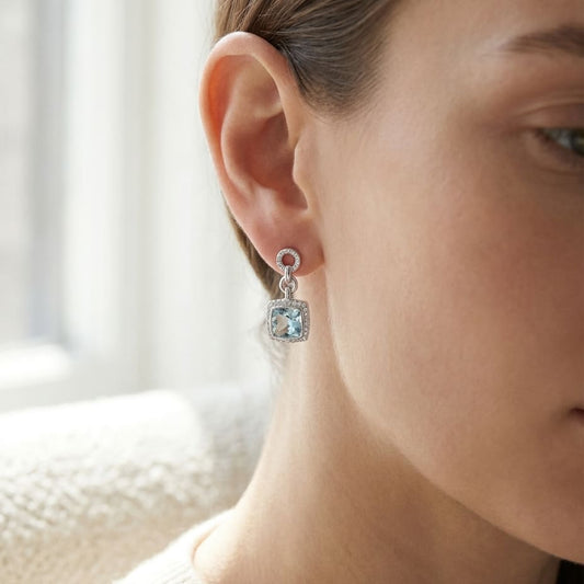 Aquamarine And Diamond Earrings in 14K White Gold, worn close-up portrait