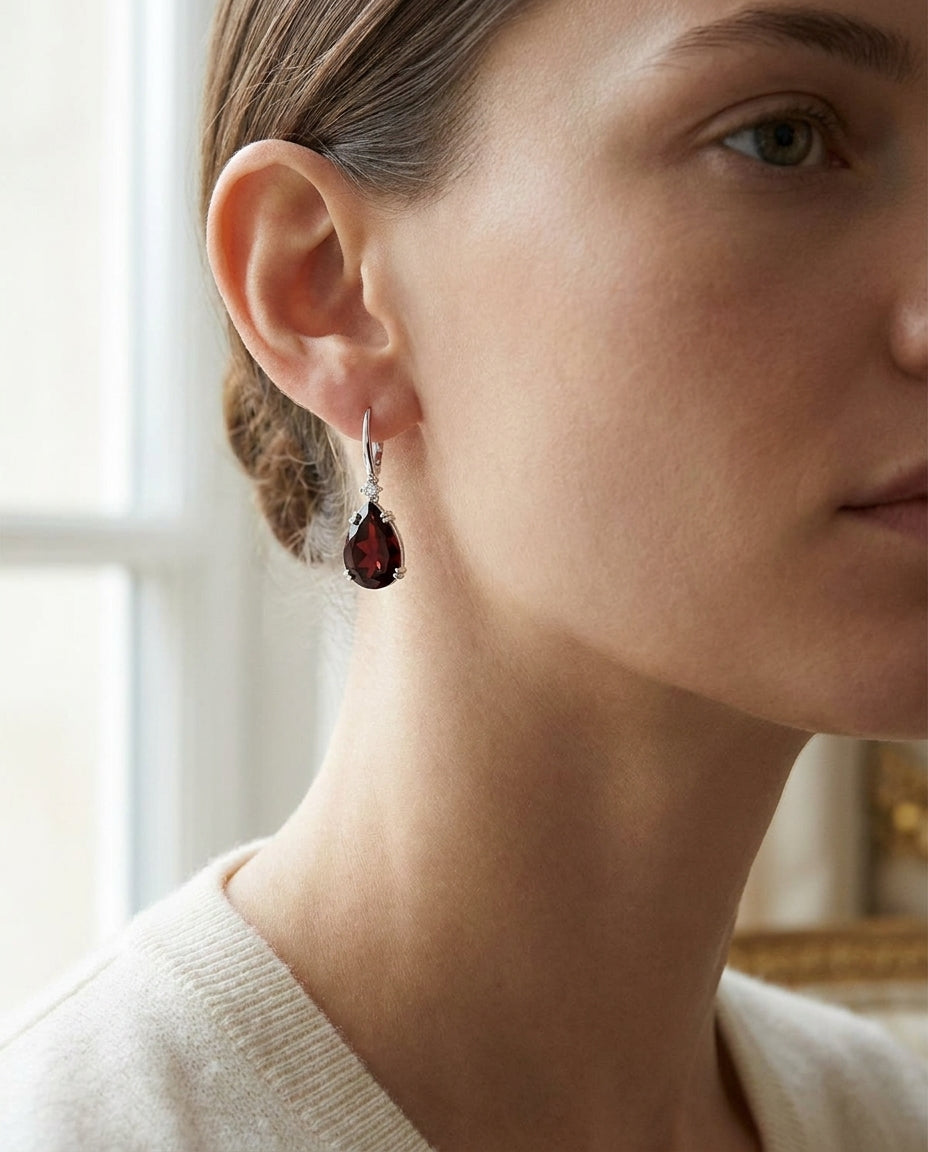 Garnet Pear And Diamond Earrings in 14K White Gold, worn close-up portrait