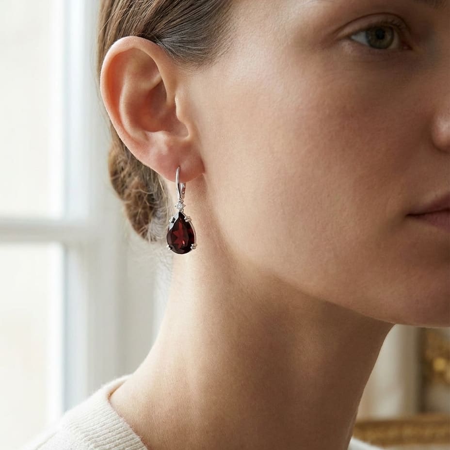 Garnet Pear And Diamond Earrings in 14K White Gold, worn close-up portrait
