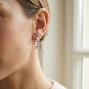 Diamond Hinged Oval Hoop Earrings in 14k White Gold 0.70ctw, worn close-up portrait
