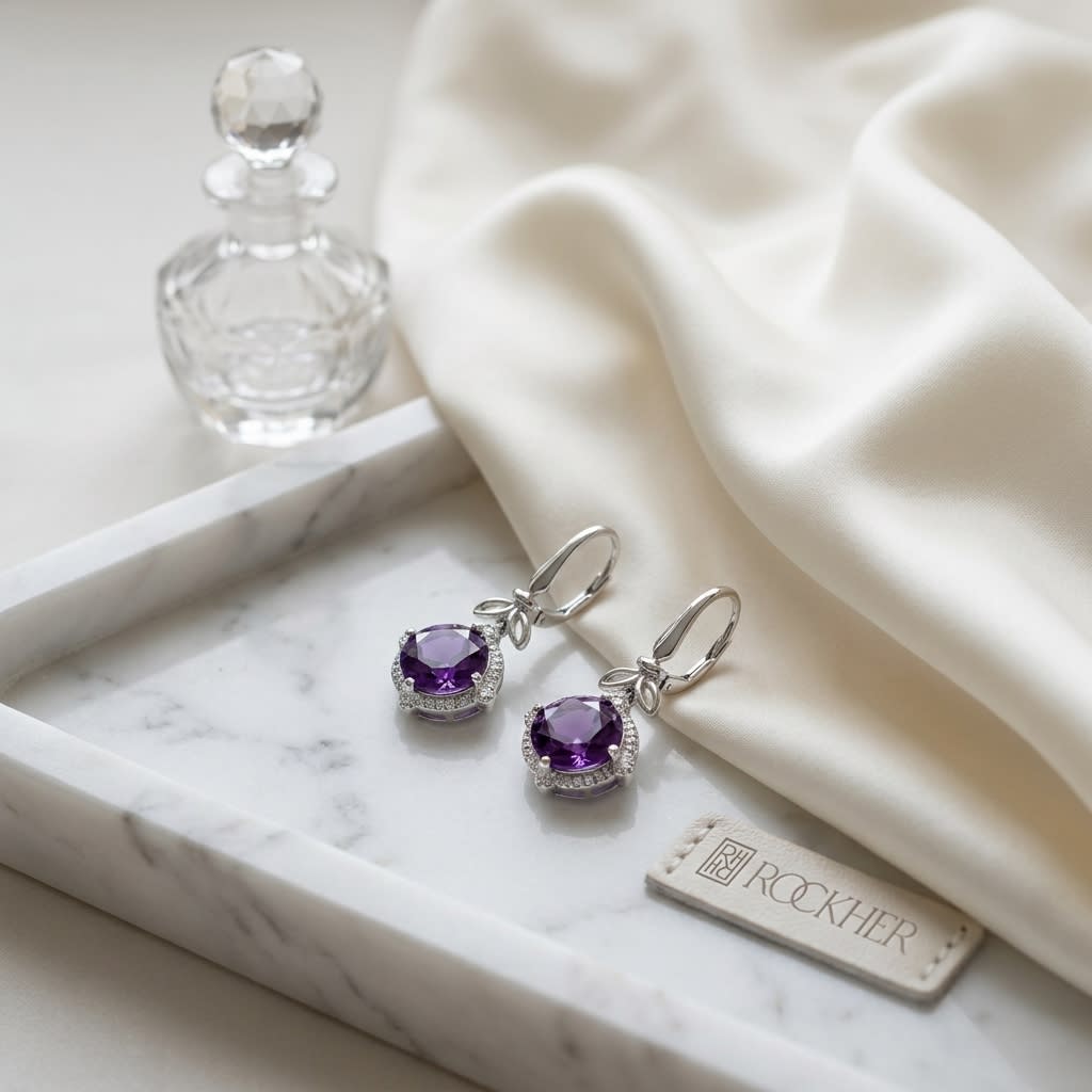Amethyst And Diamond Leaf Drop Earrings in 14K White Gold, on marble vanity tray with silk