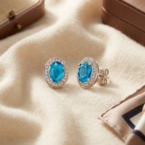 Aquamarine & Diamond Oval Halo Stud Earrings in 14K White Gold - flat lay