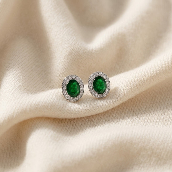 Emerald Oval & Diamond Earrings in 14K White Gold - flat lay