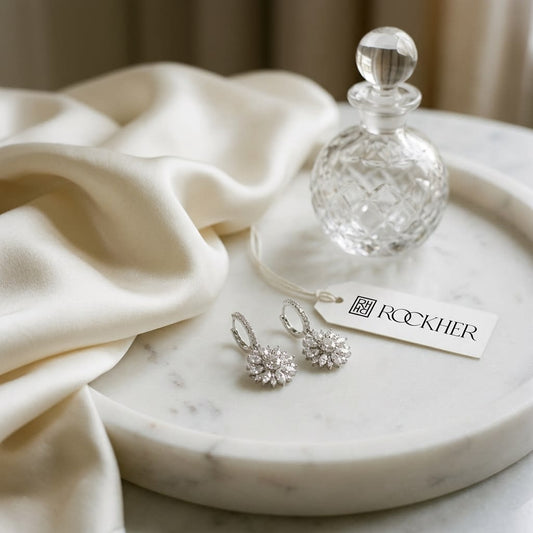 Diamond Drop Earrings in 14K White Gold, on marble vanity tray with silk