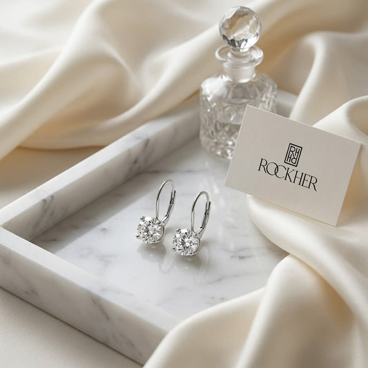 Diamond Lever Back Earrings in 14K White Gold, on marble vanity tray with silk