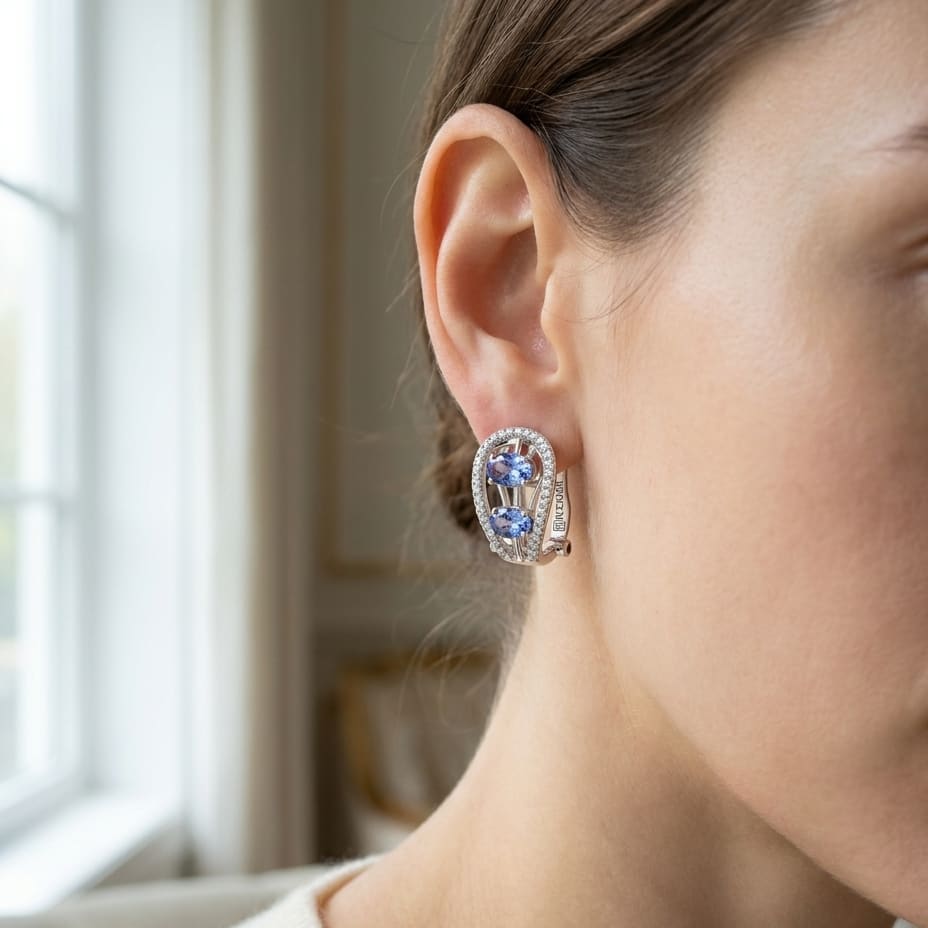 Tanzanite Round Brilliant Stud Earrings in 14K White Gold, worn close-up portrait