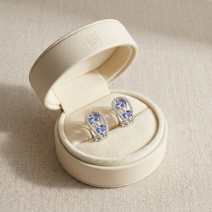 Tanzanite Round Brilliant Stud Earrings in 14K White Gold, in navy velvet jewelry box