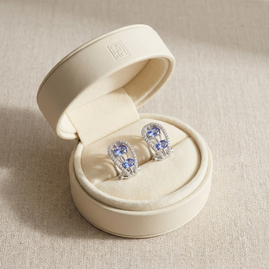 Tanzanite Round Brilliant Stud Earrings in 14K White Gold, in navy velvet jewelry box