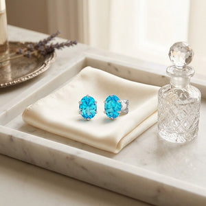 Blue Topaz Oval Stud Earrings in 14K White Gold - editorial