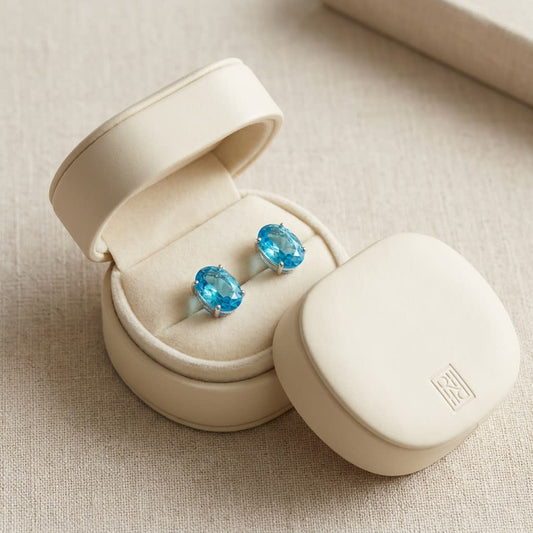 Swiss Blue Topaz Oval Stud Earrings in 14K White Gold, in navy velvet jewelry box