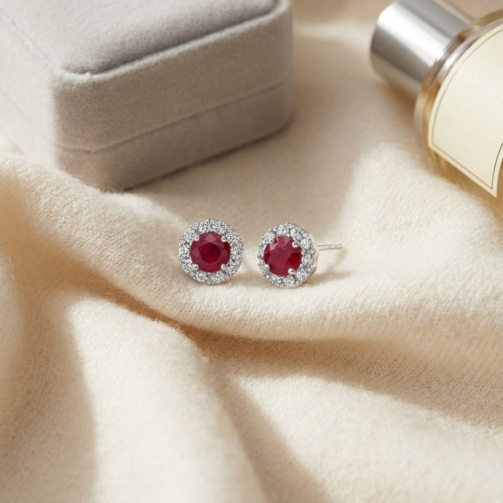 Ruby & Diamond Halo Earrings in 14K White Gold - flat lay