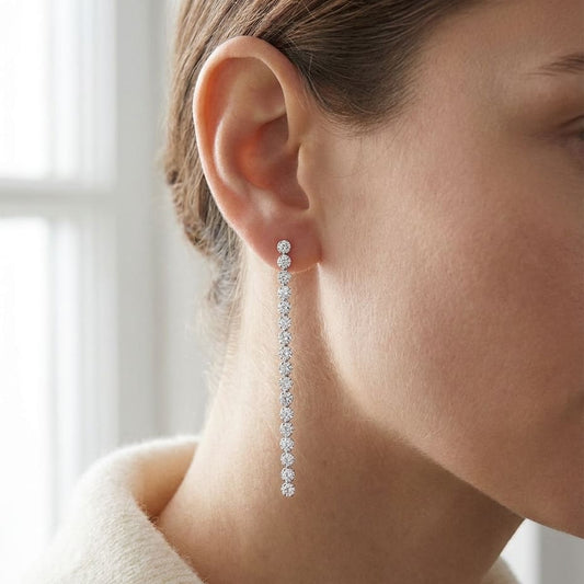 Diamond Linear Drop Earrings in 14K White Gold, worn close-up portrait