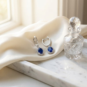Sapphire Oval & Diamond Starburst Frame Earrings in 14K White Gold - editorial