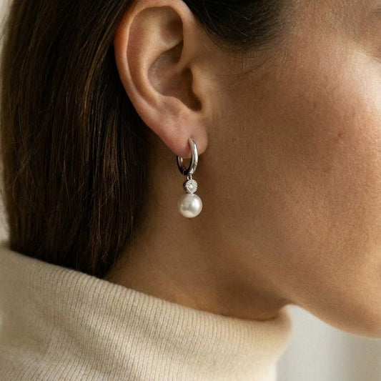 Akoya Pearl and Bezel Diamond Earrings in 14k White Gold 0.20ctw, worn close-up portrait
