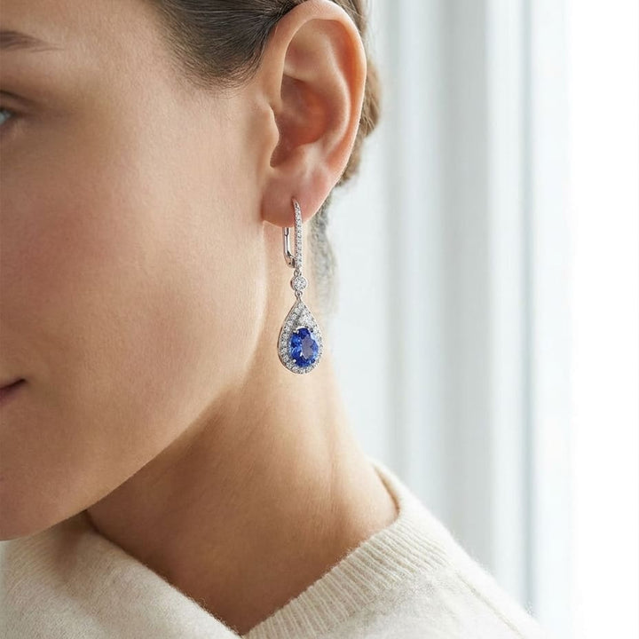 Tanzanite And Diamond Pave Drop Earrings in 14K White Gold, worn close-up portrait
