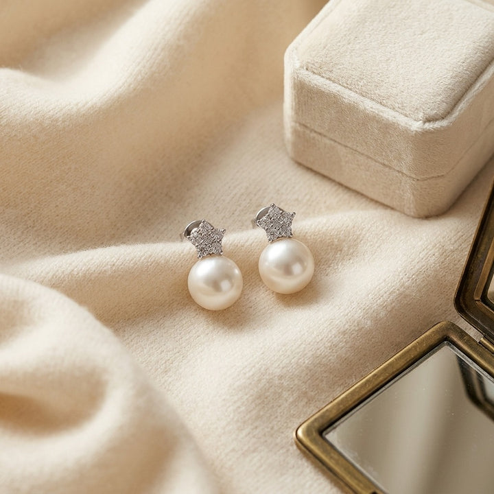 White Pearl & Diamond Earrings with Star Pave Post in 14K White Gold - flat lay