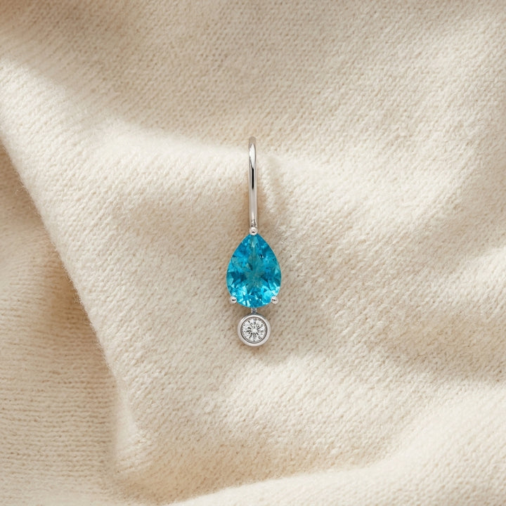 Pear Shaped Blue Topaz 7x5mm & Diamond 1/10ctw Leverback Drop Earrings Set in 14K White Gold - flat lay