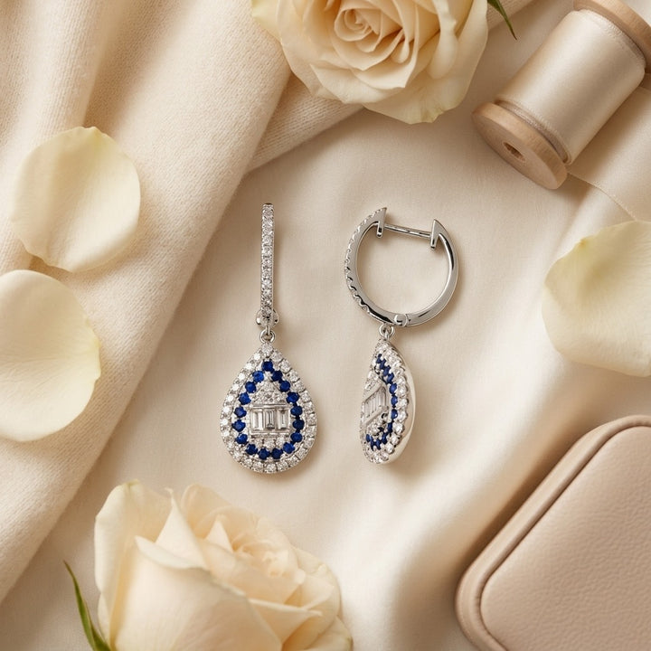 Sapphire & Diamond Pear Shape Dangle Earrings in 14K White Gold - flat lay