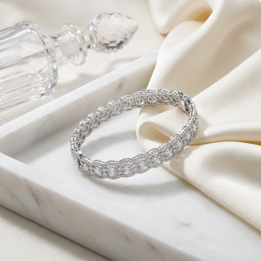 Diamond Scallop Edge Bangle in 14K White Gold, on marble vanity tray with silk