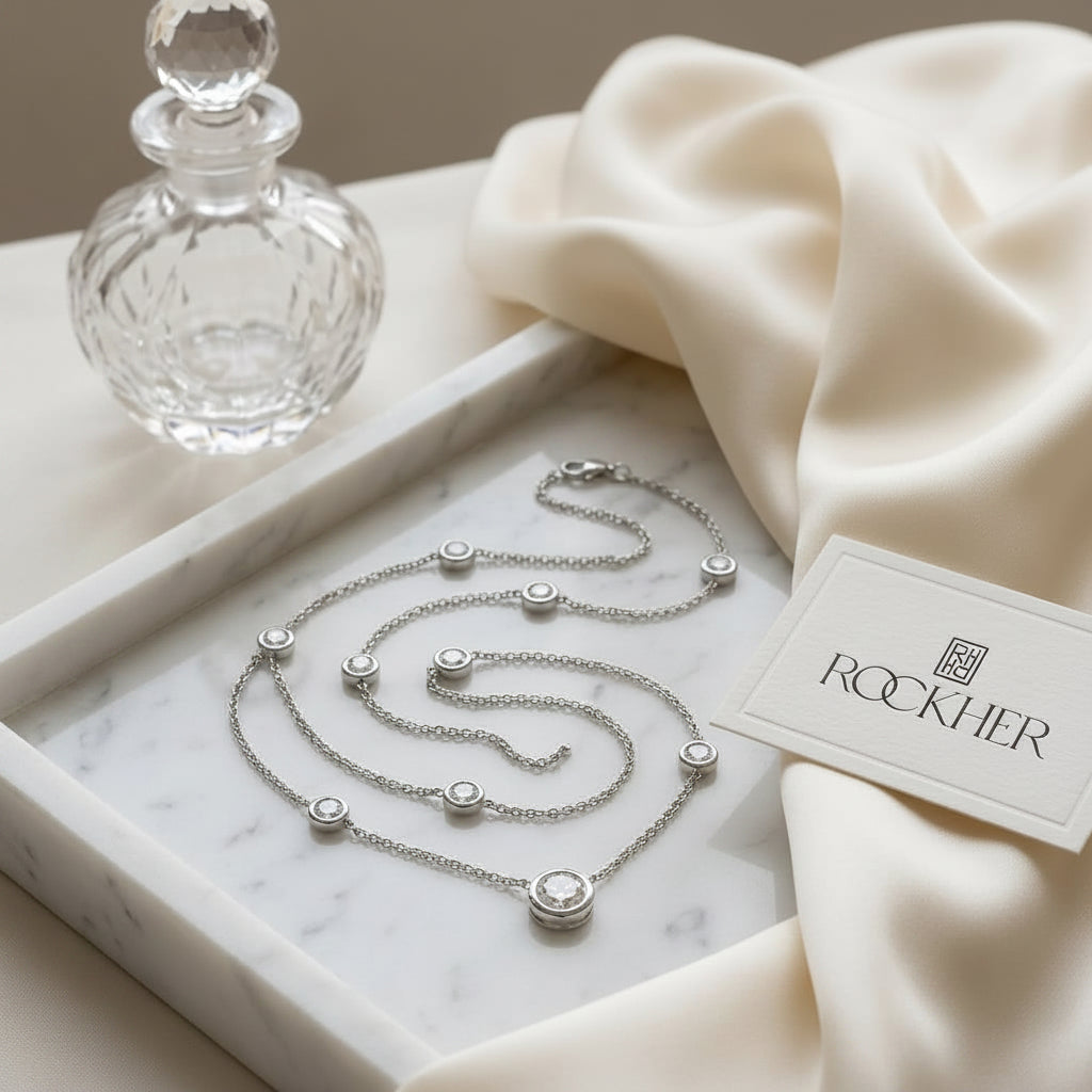 Round Diamond Bezel Necklace in 14K White Gold, on marble vanity tray with silk