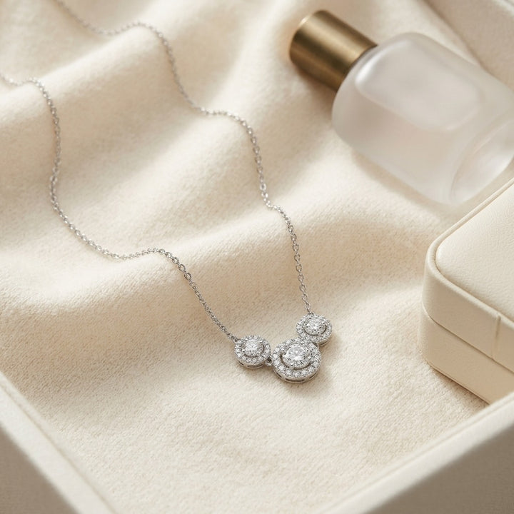 Diamond Three Stone Halo Necklace in 14K White Gold - flat lay