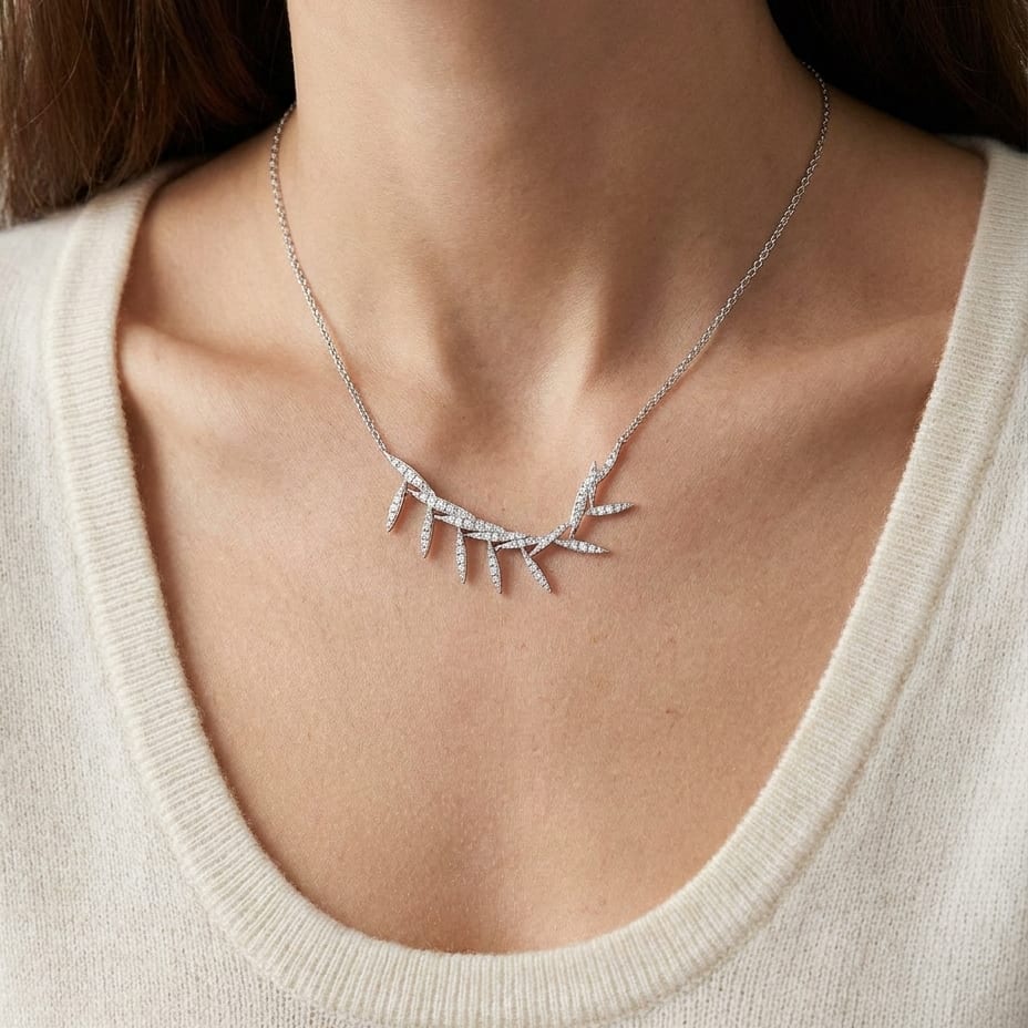 Diamond Pave Floating Laurel Leaves Necklace in 14K White Gold, worn close-up portrait