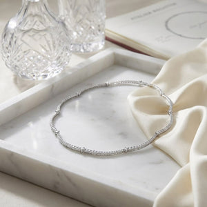 Diamond Pave And Prong-set Scallop Link Necklace in 14K White Gold (1.30ctw), on marble vanity tray with silk
